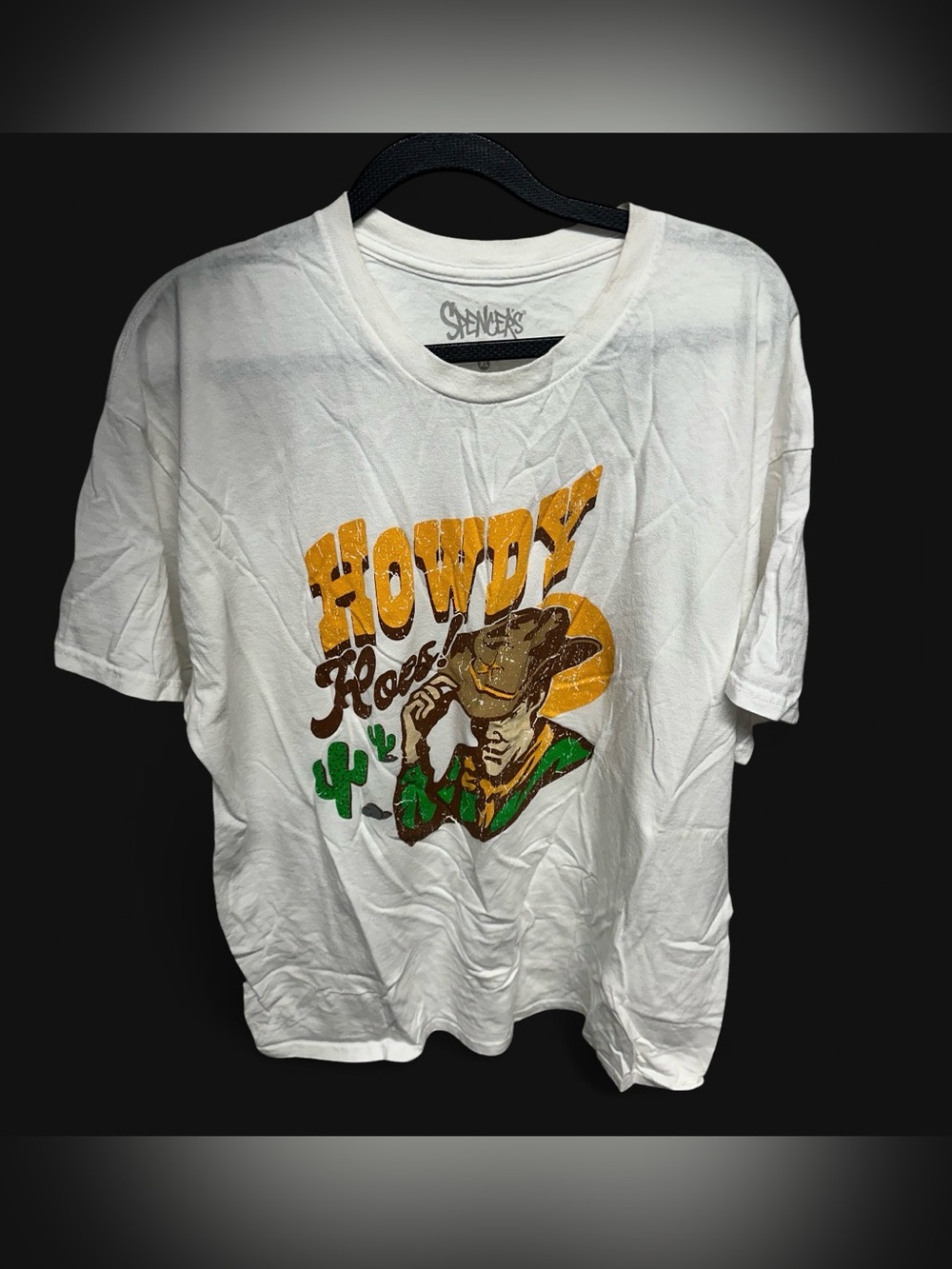 Spencer's white graphic tee with "Howdy Hoes" design. Size: XL
